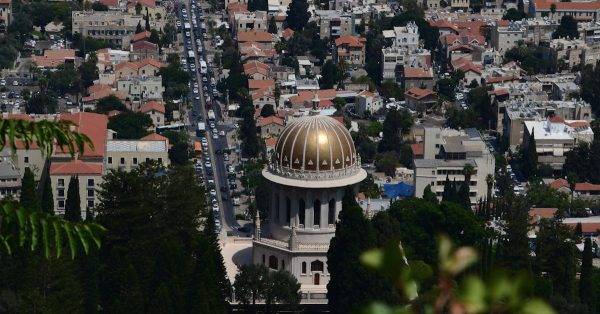 A stunning aerial view of the Shrine of the Bab in Haifa, showcasing urban architecture.